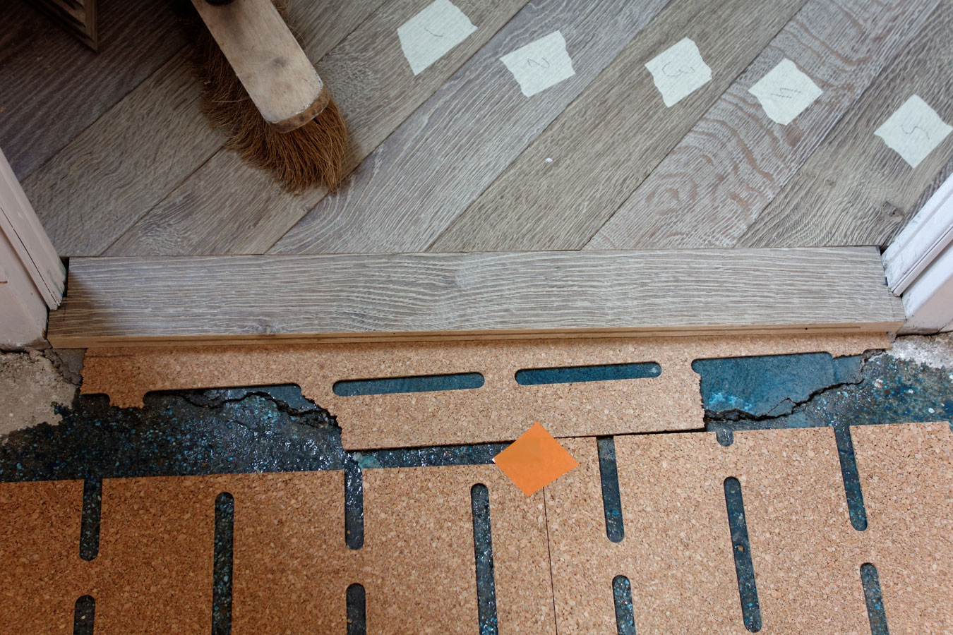 The floorboards cut on site are identified by labels.