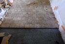 Laying End Grain Wooden Blocks in a corridor