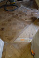Laying the Versailles oak panels