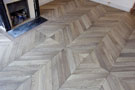 Front of the fireplace, Overview of the parquet floor Chevron leached gray oak